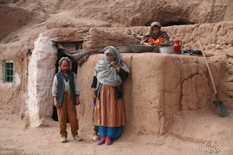 Mohammad Musa and his family outside his cave-house.